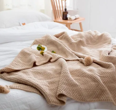 Fringed knitted wool blanket